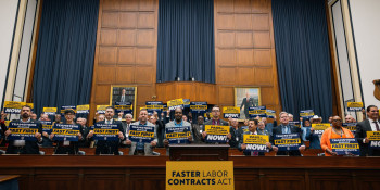 A rally for the Faster Labor Contracts Act inside a committee hearing room