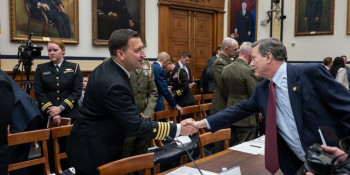 Congressman Norcross shakes the hand of a U.S. Navy admiral inside the House Armed Services Committee hearing room