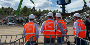 A picture of Congressman Norcross, Camden Mayor Carstarphen, Congressman Frank Pallone, and the EMR CEO observing operations at the EMR scrap metal recycling facility